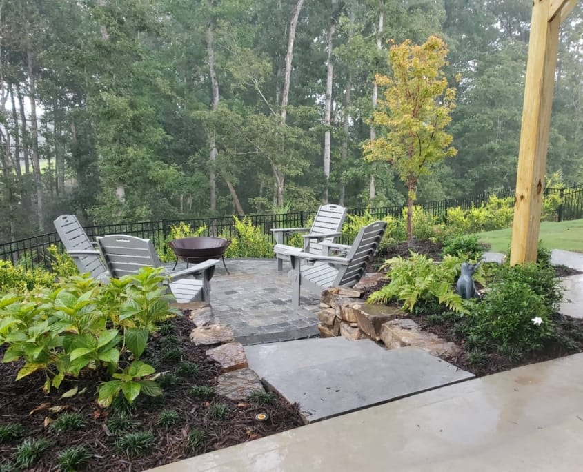 lower patio with seating and fire pit
